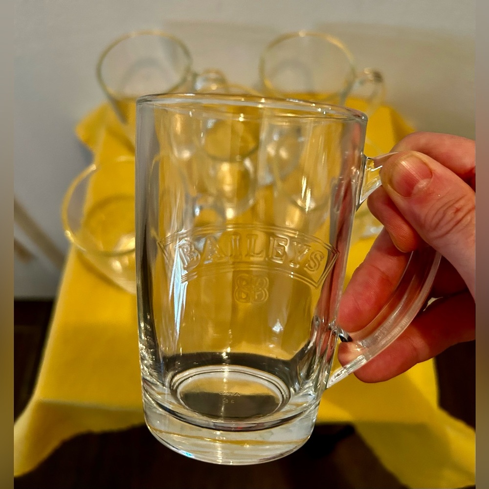 2 Bailey’s Irish cream etched coffee mugs.